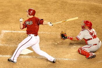 PHOENIX - JULY 28:  Mark Reynolds #27 of the Arizona Diamondbacks hits a 2 run home run against the Philadelphia Phillies during the ninth inning of the major league baseball game at Chase Field on July 28, 2009 in Phoenix, Arizona. The Phillies defeated 