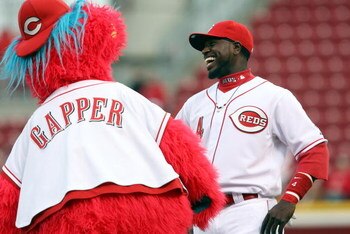 CINCINNATI, OH - APRIL 8:  Brandon Phillips #4 of the Cincinnati Reds laughs with mascot Gapper prior to the game against the New York Mets on April 8, 2009 at Great American Ballpark in Cincinnati, Ohio.  The Mets won 9-7.  (Photo by Mark Lyons/Getty Ima