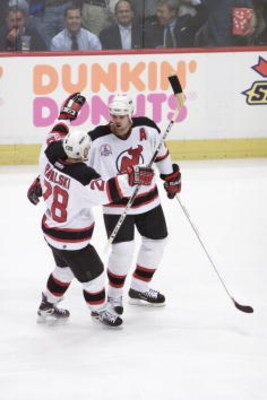 31 May 2001:   Jason Arnott #25 of the New Jersey Devils is congratulated by teammate Brian Rafalski #28 after scoring against the Colorado Avalanche in game three of the Stanley Cup finals at Continental Airlines Arena in East Rutherford, New Jersey.  Th