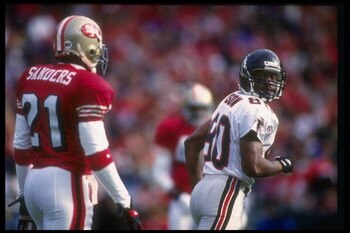 4 Dec 1994:  Wide receiver Andre Rison of the Atlanta Falcons (right) moves away from San Francisco 49ers defensive back Deion Sanders during a game at Candlestick Park in San Francisco, California.  The 49ers won the game, 50-14. Mandatory Credit: Otto G