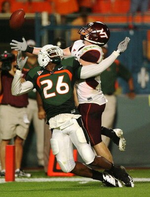 MIAMI - NOVEMBER 13:  Defensive back Anthony Reddick #26 of the Miami Hurricanes knocks the pass away from wide receiver Danny Coale #19 of the Virginia Tech Hokies at Dolphin Stadium on November 13, 2008 in Miami, Florida. Miami defeated Virginia Tech 16