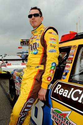 WATKINS GLEN, NY - AUGUST 09: Kyle Busch, driver of the #18 M&Ms Toyota, stands next to his car on the grid prior to the NASCAR Sprint Cup Series Heluva Good! Sour Cream Dips at Watkins Glen International on August 9, 2009 in Watkins Glen, New York.  (Pho