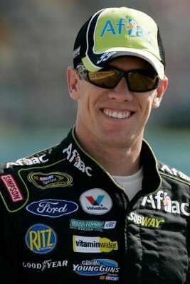 WATKINS GLEN, NY - AUGUST 07:  Carl Edwards, driver of the # Aflac Ford, walks down pit road during qualifying for the NASCAR Sprint Cup Series Heluva Good! Sour Cream Dips at Watkins Glen International on August 7, 2009 in Watkins Glen, New York.  (Photo
