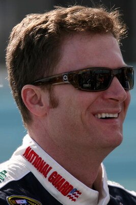 WATKINS GLEN, NY - AUGUST 07:  Dale Earnhardt Jr., driver of the #88 National Guard/AMP Energy Chevrolet, stands on the grid during qualifying for the NASCAR Sprint Cup Series Heluva Good! Sour Cream Dips at Watkins Glen International on August 7, 2009 in