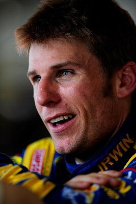 DAYTONA BEACH, FL - JULY 02: Jamie McMurray, driver of the #26 IRWIN Marathon Ford, stands in the garage area during practice for the NASCAR Sprint Cup Series Coke Zero 400 at Daytona International Speedway on July 2, 2009 in Daytona Beach, Florida.  (Pho