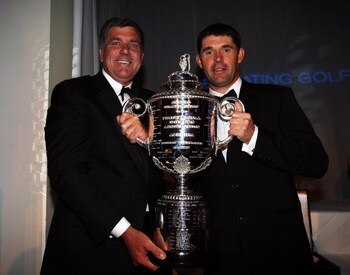WENTWORTH, ENGLAND - MAY 19:  Padraig Harrington of Ireland (right) poses with the Wanamaker trophy alongside Brian Whitcomb, PGA of America Honorary President, during The European Tour Dinner at the BMW PGA Championship at Wentworth on May 19, 2009 in Vi