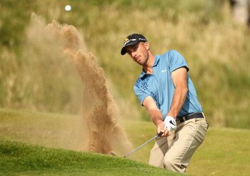TURNBERRY, SCOTLAND - JULY 16:   Geoff Ogilvy of Australia hits out of a bunker on the 8th hole during round one of the 138th Open Championship on the Ailsa Course, Turnberry Golf Club on July 16, 2009 in Turnberry, Scotland.  (Photo by Richard Heathcote/