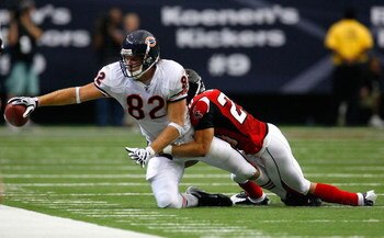 ATLANTA - OCTOBER 12:  Tight end Greg Olsen #82 of the Chicago Bears reaches for the sideline against Brent Grimes #20 of the Atlanta Falcons during the game at the Georgia Dome on October 12, 2008 in Atlanta, Georgia.  (Photo by Kevin C. Cox/Getty Images