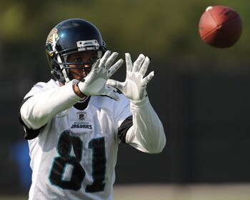 JACKSONVILLE, FL - MAY 1:  Wide receiver Torry Holt #81 of the Jacksonville Jaguars reaches for a pass during a team mini-camp on May 1, 2009 on the practice fields at Jacksonville Municipal Stadium in Jacksonville, Florida.  (Photo by Al Messerschmidt/Ge