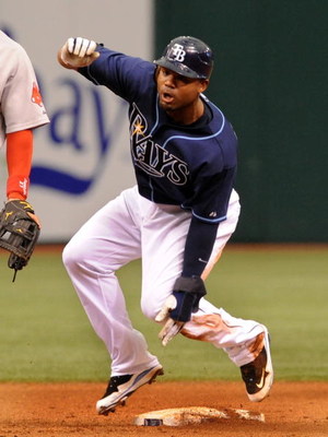ST. PETERSBURG, FL - MAY 3: Outfielder Carl Crawford #13 of the Tampa Bay Rays steals second base against the Boston Red Sox May 3, 2009 at Tropicana Field in St. Petersburg, Florida. (Photo by Al Messerschmidt/Getty Images)