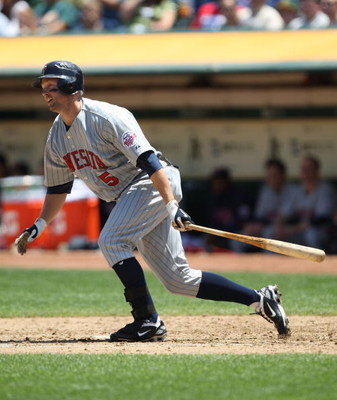 OAKLAND, CA - JUNE 11:  Michael Cuddyer #5 of the Minnesota Twins bats  against the Oakland Athletics during a Major League Baseball game on June 11, 2009 at the Oakland Coliseum in Oakland, California.  (Photo by Jed Jacobsohn/Getty Images)