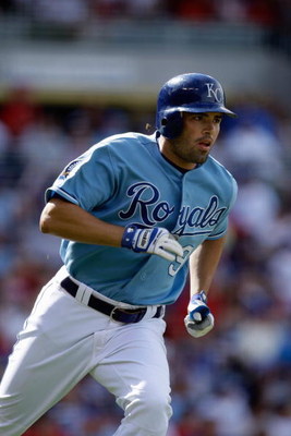KANSAS CITY, MO - JUNE 20:  David DeJesus #9 of the Kansas City Royals runs to first against the St. Louis Cardinals during the game on June 20, 2009 at Kauffman Stadium in Kansas City, Missouri. (Photo by Jamie Squire/Getty Images)