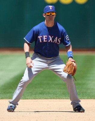 OAKLAND, CA - MAY 07:  Michael Young #10 of the Texas Rangers waits in the field against the Oakland Athletics during a Major League Baseball game on May 7, 2009 at the Oakland Coliseum in Oakland, California.  (Photo by Jed Jacobsohn/Getty Images)
