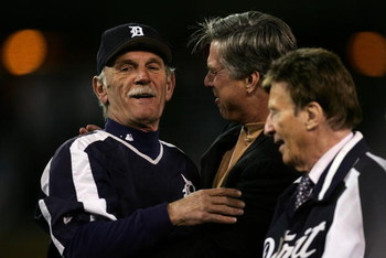 DETROIT - OCTOBER 14: Manager Jim Leyland (L) and General Manager Dave Dombrowski (C) of the Detroit Tigers celebrate after the Tigers won 6-3 against the Oakland Athletics during Game Four of the American League Championship Series October 14, 2006 at C