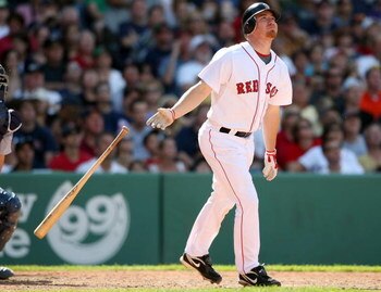 BOSTON - JULY 05:  J.D. Drew #7 of the Boston Red Sox gets a hit against the Seattle Mariners on July 5, 2009 at Fenway Park in Boston, Massachusetts.  (Photo by Elsa/Getty Images)