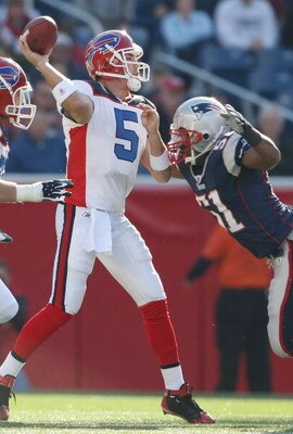 FOXBORO, MA - NOVEMBER 09:  Trent Edwards #5 of the Buffalo Bills is pressured by Jerod Mayo #51 of the New England Patriots on November 9, 2008 at Gillette Stadium in Foxboro, Massachusetts.  (Photo by Elsa/Getty Images)