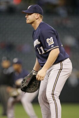 DENVER - AUGUST 16:  First baseman Lyle Overbay #11 of the Milwaukee Brewers prepares for a pitch against the Colorado Rockies on August 16, 2005 at Coors Field in Denver, Colorado.   The Brewers won 6-4.  (Photo by Brian Bahr/Getty Images)