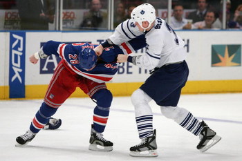 NEW YORK - DECEMBER 06: Colton Orr #28 of the New York Rangers fights with Wade Belak #3 of the Toronto Maple Leafs during their game on December 6, 2007 at Madison Square Garden in New York City. (Photo by Chris McGrath/Getty Images)