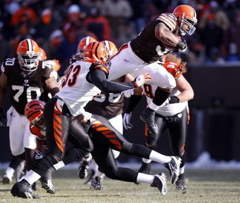 CLEVELAND - DECEMBER 21: Jamal Lewis #31 of the Cleveland Browns jumps over Chinedum Ndukwe #41 of the Cincinnati Bengals for a first quarter first down at Cleveland Browns Stadium December 21, 2008 in Cleveland, Ohio.  (Photo by Gregory Shamus/Getty Imag
