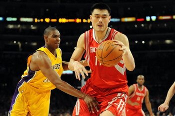 LOS ANGELES, CA - MAY 06:  Yao Ming #11 of the Houston Rockets moves the ball against Andrew Bynum #17 of the Los Angeles Lakers in Game Two of the Western Conference Semifinals during the 2009 NBA Playoffs at Staples Center on May 6, 2009 in Los Angeles,