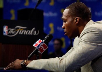 ORLANDO, FL - JUNE 14:  Dwight Howard #12 of the Orlando Magic looks down during the post game news conference after losing to the Los Angeles Lakers 99-86 in Game Five of the 2009 NBA Finals on June 14, 2009 at Amway Arena in Orlando, Florida.  NOTE TO U