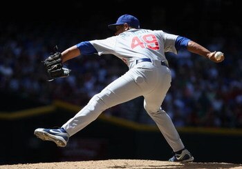 PHOENIX - APRIL 29:  Relief pitcher Carlos Marmol #49 of the Chicago Cubs pitches against the Arizona Diamondbacks during the game at Chase Field on April 29, 2009 in Phoenix, Arizona. The Diamondbacks defeated the Cubs 10-0.  (Photo by Christian Petersen