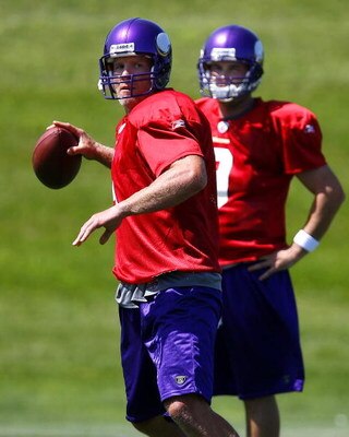 EDEN PRAIRIE, MN - AUGUST 18:  Brett Favre #4 (L) throw a pass during a Minnesota Vikings practice session as John David Boty watches on August 18, 2009 at Winter Park in Eden Prairie, Minnesota. Favre has reportedly agreed to play for the Vikings, a reve