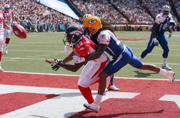 HONOLULU, HI - FEBRUARY 08: Wide receiver Brandon Marshall #15 of the AFC All-Stars Denver Broncos tries to catch an end zone pass broken up by cornerback Al Harris #31 of the the NFC All-Stars Green Bay Packers in the 2009 NFL Pro Bowl at Aloha Stadium o