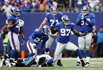 EAST RUTHERFORD, NJ - DECEMBER 07: Mathias Kiwanuka #97 of the New York Giants celebrates a tackle agianst the Philadelphia Eagles at Giants Stadium on December 7, 2008 in East Rutherford, New Jersey.  (Photo by Nick Laham/Getty Images)