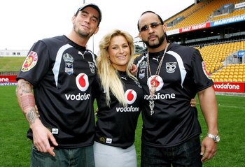 AUCKLAND, NEW ZEALAND - JUNE 11:  (L-R) WWE wrestlers CM Punk, Natalya and MVP pose for a photo with Warriors jerseys after a  Warriors NRL  training session at Mt Smart Stadium on June 11, 2008 in Auckland, New Zealand.  (Photo by Sandra Mu/Getty Images)