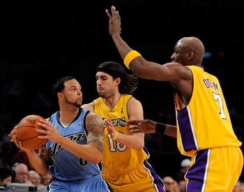 LOS ANGELES, CA - APRIL 27:  Deron Williams #8 of the Utah Jazz is double-teammed by Sasha Vujacic #18 and Lamar Odom #7 of the Los Angeles Lakers in the second half of Game Five of the Western Conference Quarterfinals during the 2009 NBA Playoffs at Stap