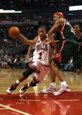 CHICAGO - MARCH 06:  Derrick Rose #1 of the Chicago Bulls drives against Charlie Villanueva #31 of the Milwaukee at the United Center on March 6, 2009 in Chicago, Illinois.  NOTE TO USER: User expressly acknowledges and agreees that, by downloading and/or
