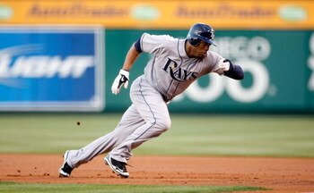 ANAHEIM, CA - AUGUST 10:  Carl Crawford #13 of the Tampa Bay Rays leads off first base against the Los Angeles Angels of Anaheim at Angel Stadium on August 10, 2009 in Anaheim, California.  (Photo by Jeff Gross/Getty Images)