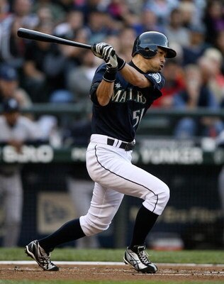 SEATTLE  - AUGUST 14:  Ichiro Suzuki #51 of the Seattle Mariners singles in the first inning against the New York Yankees on August 14, 2009 at Safeco Field in Seattle, Washington. (Photo by Otto Greule Jr/Getty Images)