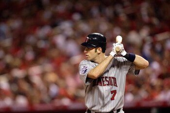 ST. LOUIS, MO - JULY 14:  American League All-Star Joe Mauer of the Minnesota Twins bats during the 2009 MLB All-Star Game at Busch Stadium on July 14, 2009 in St Louis, Missouri. (Photo by Jamie Squire/Getty Images)