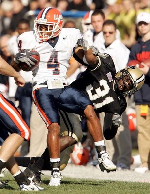 WEST LAFAYETTE, IN - NOVEMBER 12:  Head Derrick McPhearson #4 of the Illinois Fighting Illini is brought down by Bernard Pollard #31 on November 12, 2005 at Ross-Ade Stadium in St. West Lafayette, Indiana.  (Photo by Elsa/Getty Images)
