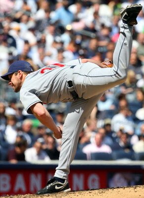 NEW YORK - APRIL 16:  Cliff Lee #31 of the Cleveland Indians pitches against the New York Yankees during opening day at the new Yankee Stadium on April 16, 2009 in the Bronx borough of New York City. This is the first regular season MLB game being played 