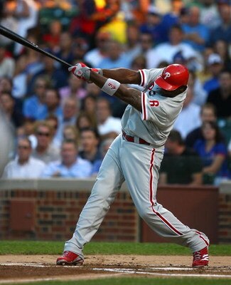 CHICAGO - AUGUST 12: Ryan Howard #6 of the Philadelphia Phillies hits a triple in the first inning against the Chicago Cubs on August 12, 2009 at Wrigley Field in Chicago, Illinois. The Phillies defeated the Cubs 12-5. (Photo by Jonathan Daniel/Getty Imag