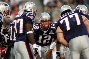 PHILADELPHIA - AUGUST 13:  Tom Brady #12 of the New England Patriots huddles with his teammates against the Philadelphia Eagles on August 13, 2009 at Lincoln Financial Field in Philadelphia, Pennsylvania.  (Photo by Jim McIsaac/Getty Images)