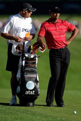 CHASKA, MN - AUGUST 16:  Tiger Woods (R) waits with his caddie Steve Williams during the final round of the 91st PGA Championship at Hazeltine National Golf Club on August 16, 2009 in Chaska, Minnesota.  (Photo by Jamie Squire/Getty Images)