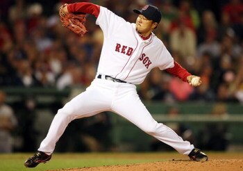 BOSTON - JULY 07: Hideki Okajima #37 of the Boston Red Sox delivers a pitch in the seventh inning against the Oakland Athletics on July 7, 2009 at Fenway Park in Boston, Massachusetts.  (Photo by Elsa/Getty Images)