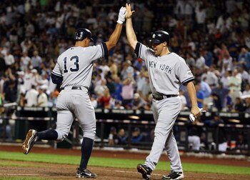 NEW YORK - JUNE 26:  Alex Rodriguez #13 of the New York Yankees celebrates his eighth-inning two-run home run against the New York Mets with teammate Mark Teixeira #25 on June 26, 2009 at Citi Field in the Flushing neighborhood of the Queens borough of Ne