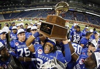DETROIT - DECEMBER 05: Mike Newton #30 of the Buffalo Bulls celebrates the MAC Championship with teammates after defeating the Ball State Cardinals on December 5, 2008 at Ford Field in Detroit, Michigan. (Photo by Gregory Shamus/Getty Images)