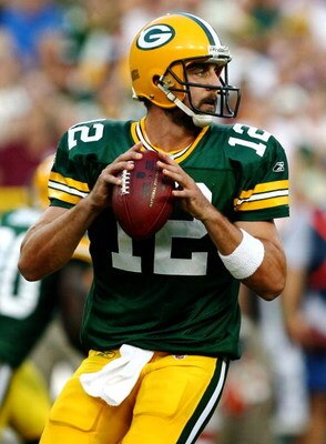 GREEN BAY, WI - AUGUST 15:  Quarterback Aaron Rodgers #12 of the Green Bay Packers looks to pass the ball in the first quarter against the Cleveland Browns during the preseason game at Lambeau Field on August 15, 2009 in Green Bay, Wisconsin. (Photo by Jo