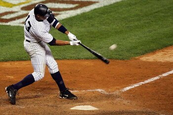 NEW YORK - OCTOBER 08:  Alex Rodriguez #13 of the New York Yankees hits a solo home run seventh inning against the Cleveland Indians during Game Four of the American League Division Series at Yankee Stadium on October 8, 2007 in the Bronx borough of New Y