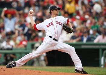 BOSTON - AUGUST 13:  Starting Pitcher Clay Buchholz #61 of the Boston Red Sox delivers the pitch in the first inning during the game against the Detroit Tigersat Fenway Park on August 13, 2009 in Boston, Massachusetts. (Photo by Elsa/Getty Images)