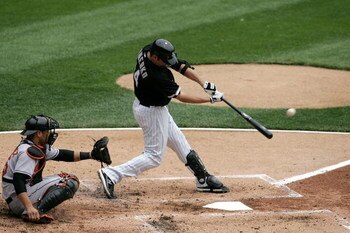 CHICAGO - APRIL 27:  Paul Konerko #14 of the Chicago White Sox hits a solo home run in the bottom of the second inning to give the White Sox a 1-0 lead against the Baltimore Orioles on April 27, 2008 at U.S. Cellular Field in Chicago, Illinois.  (Photo by