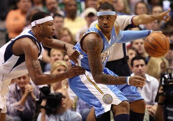 DALLAS - MAY 11:  Forward Carmelo Anthony #15 of the Denver Nuggets dribbles the ball against Antoine Wright of the Dallas Mavericks in Game Four of the Western Conference Semifinals during the 2009 NBA Playoffs at American Airlines Center on May 11, 2009