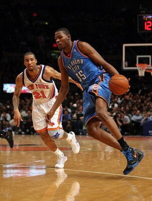 NEW YORK - NOVEMBER 14:  Kevin Durant #35 of the Oklahoma City Thunder drives past Wilson Chandler #21 of the New York Knicks on November 14, 2008 at Madison Square Garden in New York City, New York. NOTE TO USER: User expressly acknowledges and agrees th