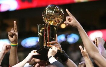 DALLAS - JUNE 20:  The Miami Heat hold up the Larry O'Brien trophy after they defeated the Dallas Mavericks in game six of the 2006 NBA Finals on June 20, 2006 at American Airlines Center in Dallas, Texas.  The Heat won 95-92 and win the series 4-2.  NOTE